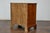 An English pine chest from the 19th century with three graduating drawers and brass hardware. This English pine chest from...