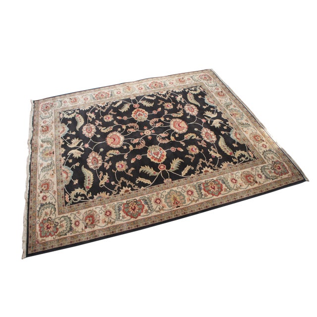 Vintage Karastan 100% wool area rug / mat / carpet featuring a floral motif inspired by palmettes and scrolled vines on a...