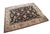 Vintage Karastan 100% wool area rug / mat / carpet featuring a floral motif inspired by palmettes and scrolled vines on a...