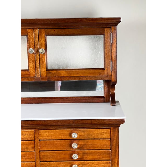 This really great early 20th century dental cabinet by The American Cabinet Co. is a wonderful example of the highly...
