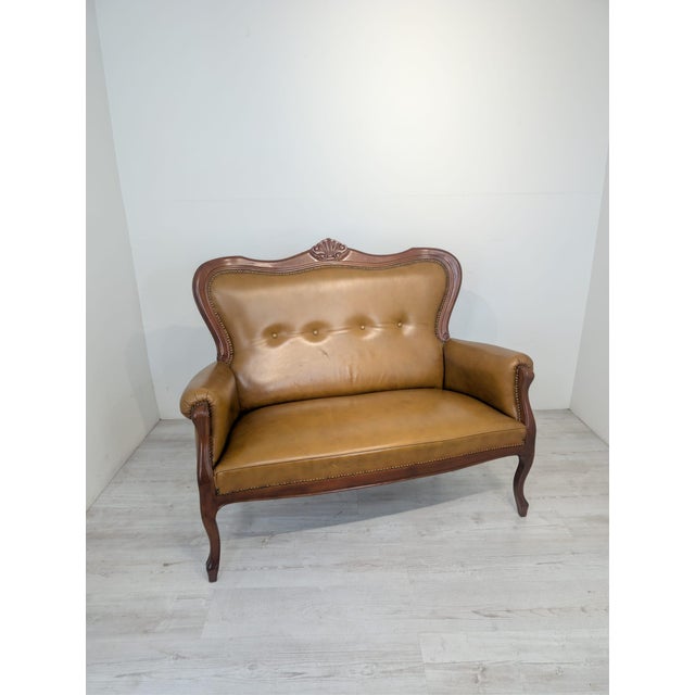 Chippendale Leather Two-Seater Sofa from the 1960s This 1960s Chippendale-style two-seater sofa with springs is...
