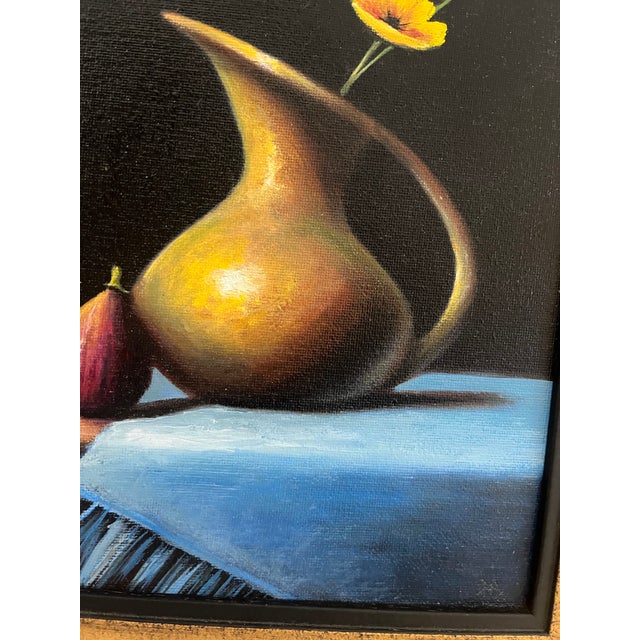 This professionally framed piece pops with its black background and rich colors of yellows, gold, blue and burnt reds....