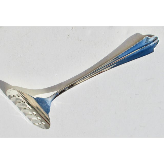 Sterling Silver server for tomatos and other juicy vegetables. Made by the Sterling Silver Mfg. Co. Rhode Island circa...