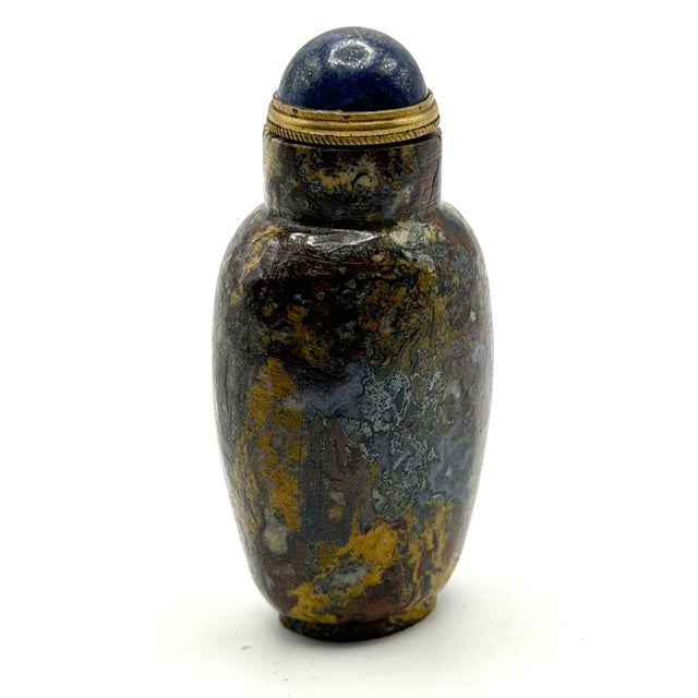 This is the most colorful stone snuff bottle from my collection. The rock identifier suggested three different stones from...