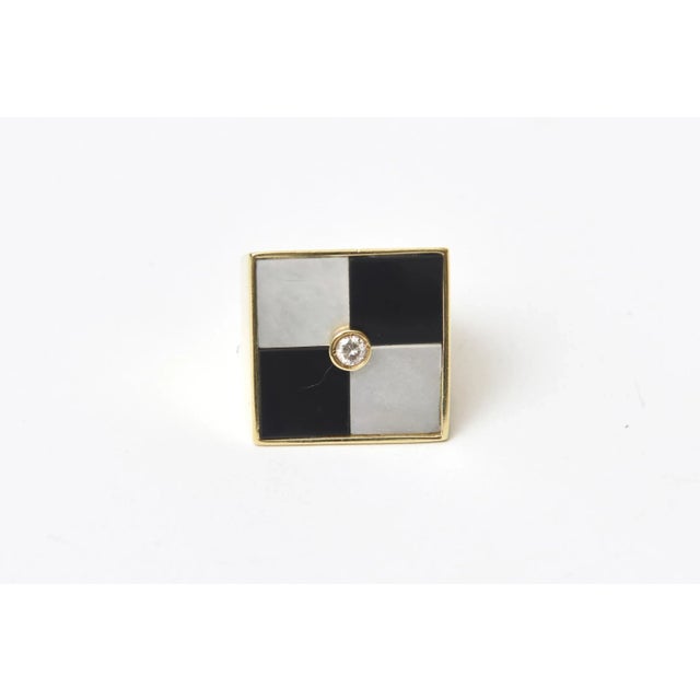 This is part of Chairish’s Fine Jewelry assortment. This stunning italian 1970's vintage Italian square 18K gold, onyx and...