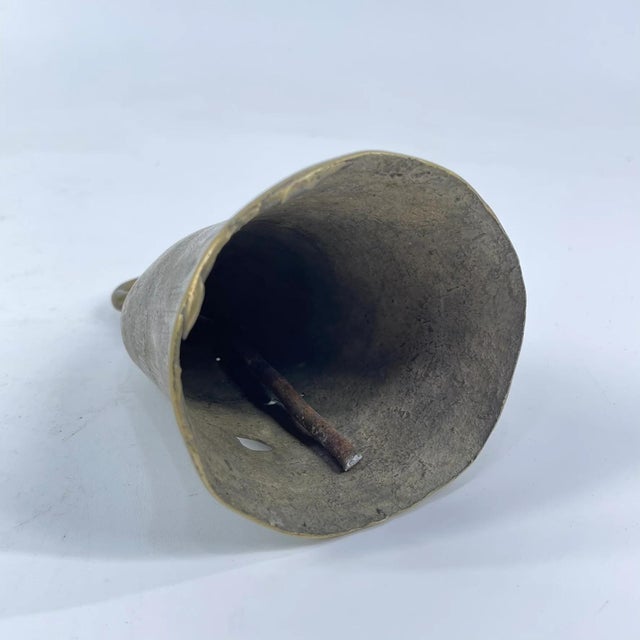 The brass metal bell was crafted by the Benue and Chamba artisans and metalworkers of Nigeria. These bells were often used...