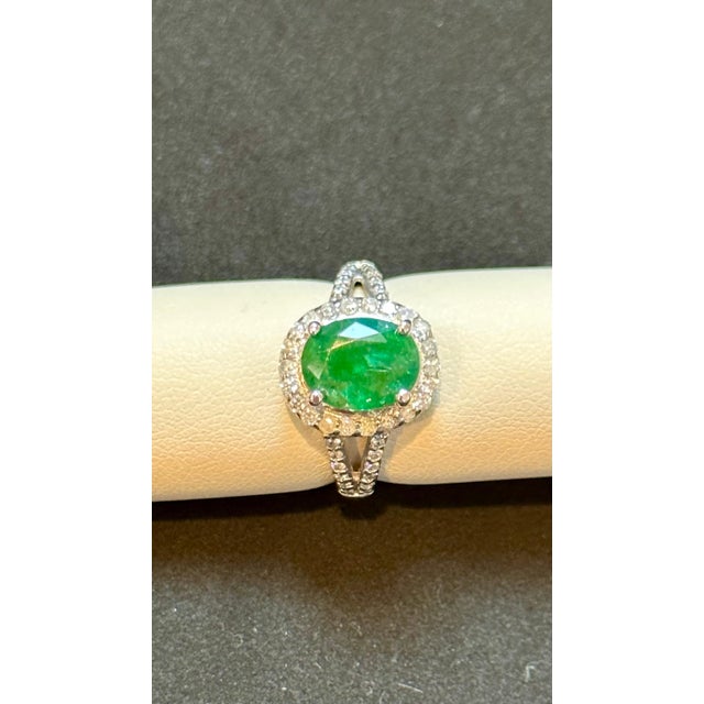 Prepare to be amazed by the sheer beauty of the 3.5 Carat Oval Natural Zambian Emerald & 1.8 ct of Diamond Ring, a true...