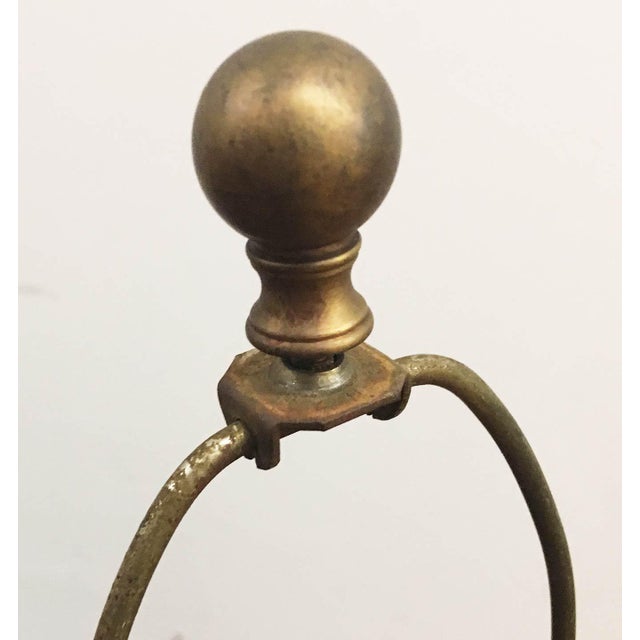 Mid century ceramic lamp with raised pattern, mimicking hammered copper or brass. Brass switch and finial. Black pleated...