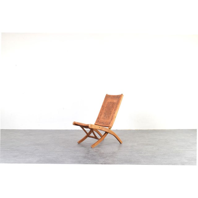This distinctive armchair was designed by Ángel I. Pazmiño for the Ecuadorian manufacturer Muebles de Estilo in the 1960s....