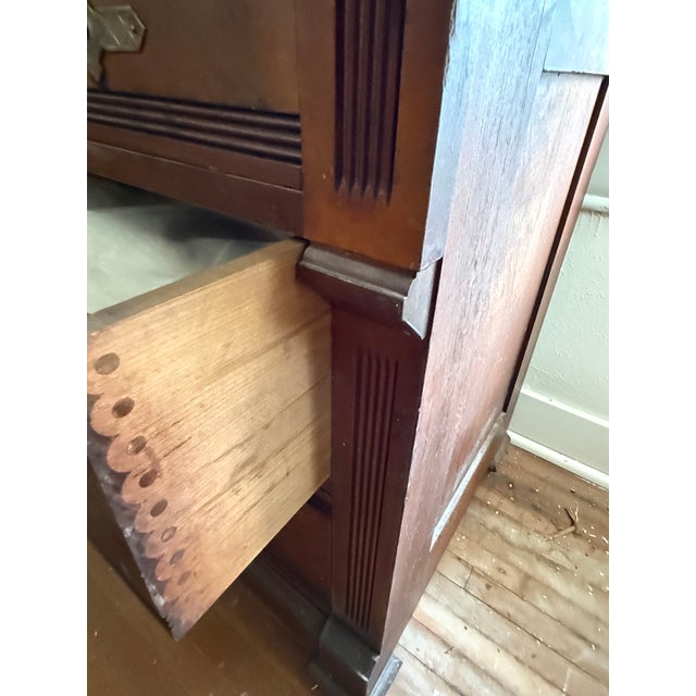 This striking late 19th-century dresser is a fine example of Victorian style craftsmanship, likely influenced by the...