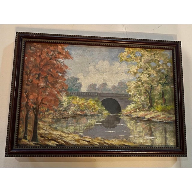 A very nice small oil on board painting of a Hudson Valley landscape of a bridge over a stream with autumn foliage trees...