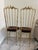 A stunning pair of authentic Italian brass Chiavari chairs dating to the 1960s, sourced from a Palm Beach estate. These...