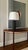 A pair of highly textured metal lamps with matching rusticated finials. Lamp bases feature a scallop leading edge and...