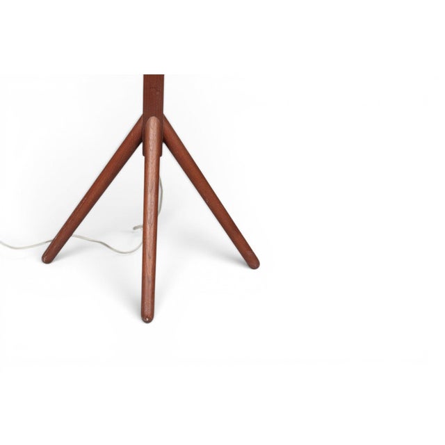 A striking 1950s Danish teak floor speaker mounted on a slender tripod base — equal parts hi-fi equipment and sculptural...