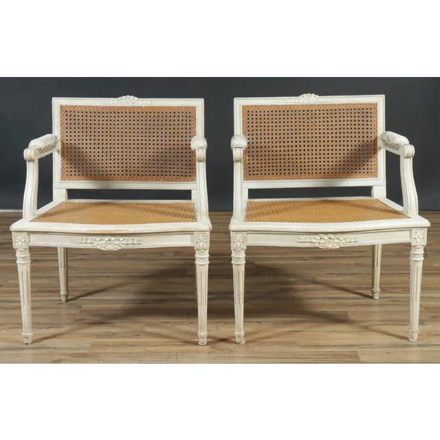 Pair of Louis XVI Style Caned with wooden frames Fauteuils, white painted. Very elegant and well apportioned 31" H x 26.5"...