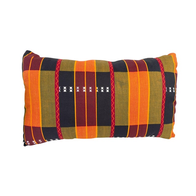 The African Kente cotton Cloth Pillow is a unique and stylish addition to any home decor, featuring a lumbar shape with...