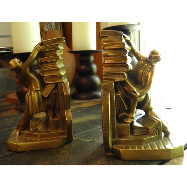 PM CRAFTSMAN Cast Metal Brass Bookends Colonial Librarian Falling Books USA These PM Craftsman bookends feature a unique...