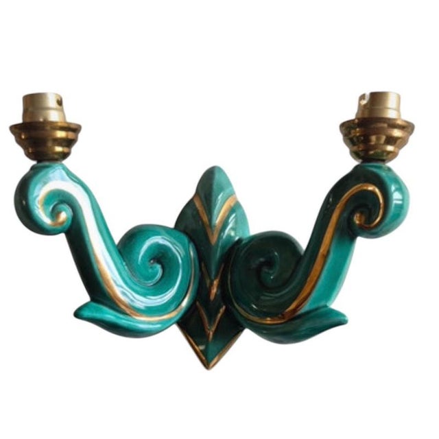 A rare pair of French Art Deco double-arm wall sconces in turquoise glazed ceramic with hand-applied gold banding. Each...