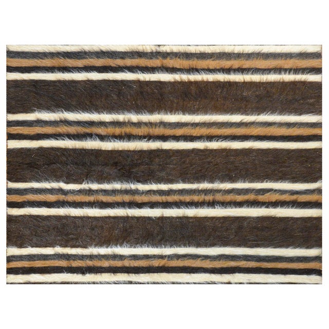 A fantastic vintage Turkish Siirt rug woven with alternating brown, black, white, and camel-colored stripes.