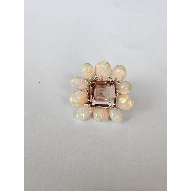 A very gorgeous and beautiful, Opal & Tourmaline Cocktail Ring set in 18K Rose Gold & natural Diamonds. The weight of the...