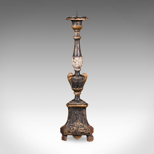 This is an antique candle pricket. An English, ebonised oak and fruitwood candlestick, dating to the Georgian period,...