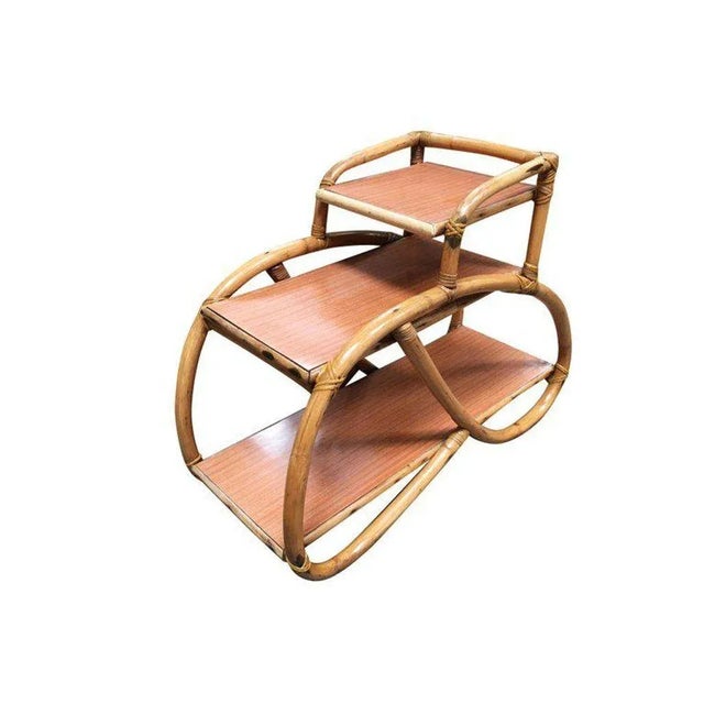 3/4 Pretzel rattan side table with three-tier Formica tops. 1950, United States We only purchase and sell only the best...