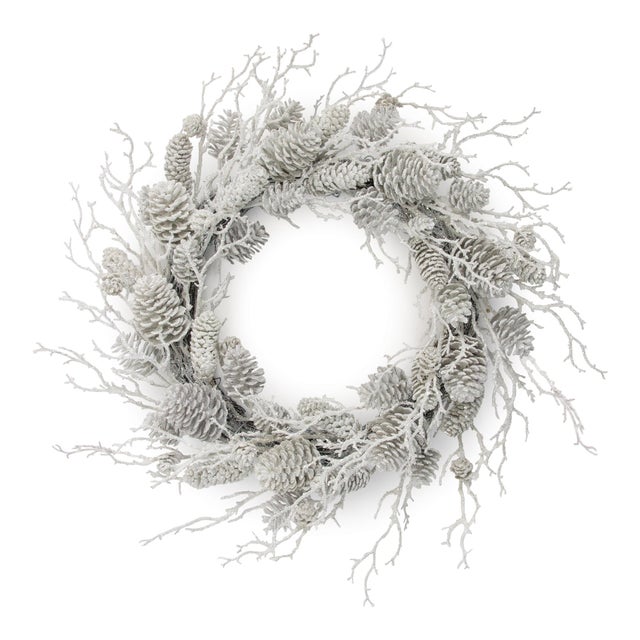 Transform your home into a winter wonderland with this Flocked Pine Cone and Twig Wreath. Featuring natural pine cones and...