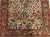 Antique Persian rug, displaying an array of flowers and nightingales. Wool pile on cotton foundation.