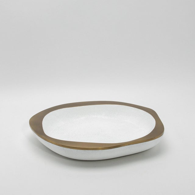 The Lily Bowl in white shagreen and bronze patina brass by R&Y Augousti exudes refined elegance through its striking...