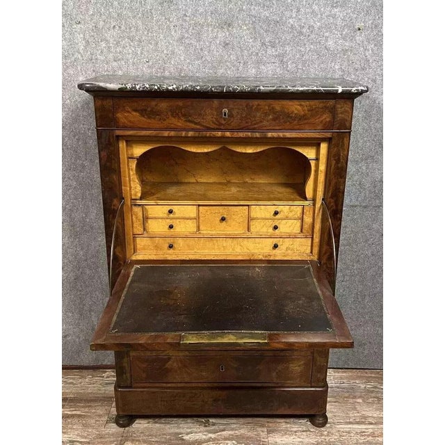 Louis Philippe/Restoration period secretary desk in mahogany and maple, circa 1820. Features four drawers and a drop-front...