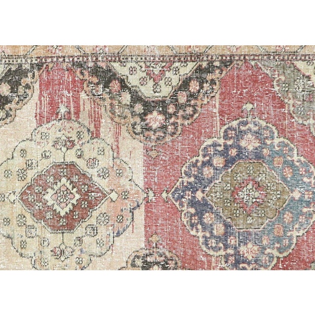 This Vintage Turkish Oushak Rug, hand woven with wool on wool foundation in the Oushak region of Western Turkey, measures...