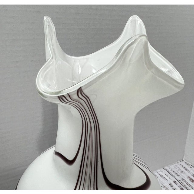 This elegant vintage Murano-style art glass vase showcases the timeless beauty and craftsmanship associated with the...