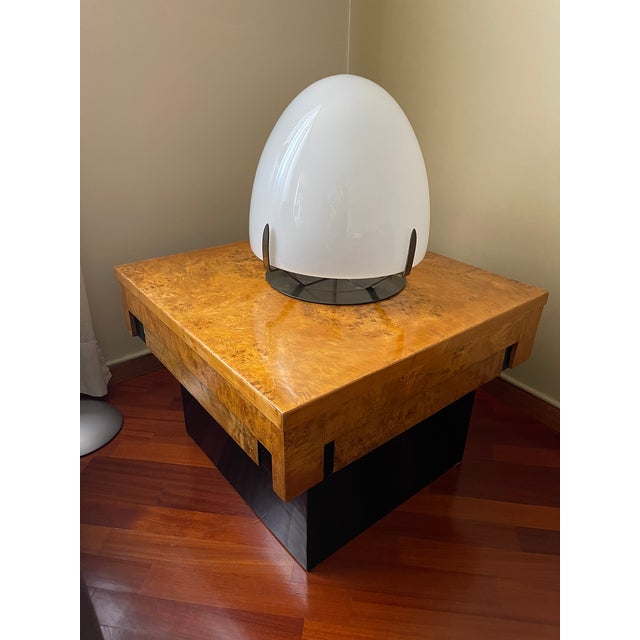 Elegant Italian table lamp made in the 1970s, featuring a large blown opal glass diffuser and a chromed metal base. The...