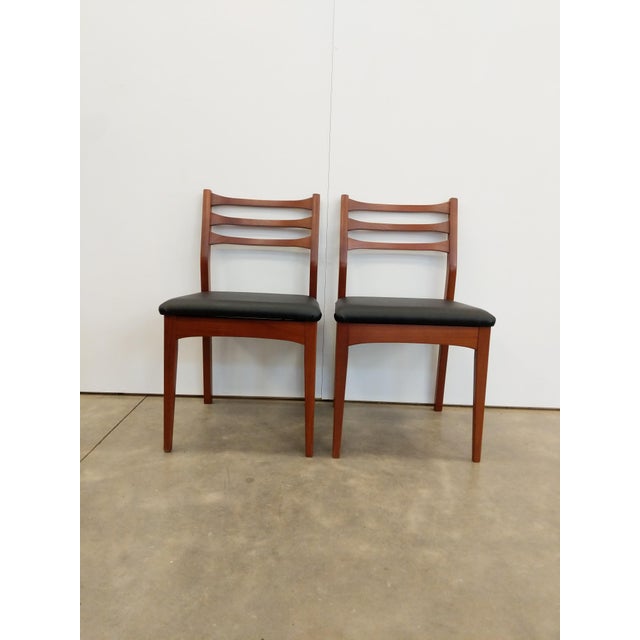 Pair of authentic vintage mid century modern dining chairs. Dated "17 November 1975" on bottoms. This set is in excellent...