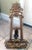 This hand-carved picture easel has a Mexican or Country design to it. It is made from thick wood that is painted gold. The...