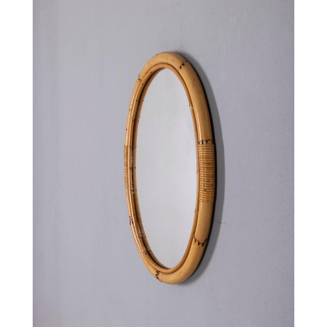 Oval wall mirror with bamboo frame, Italian design, 1960s.