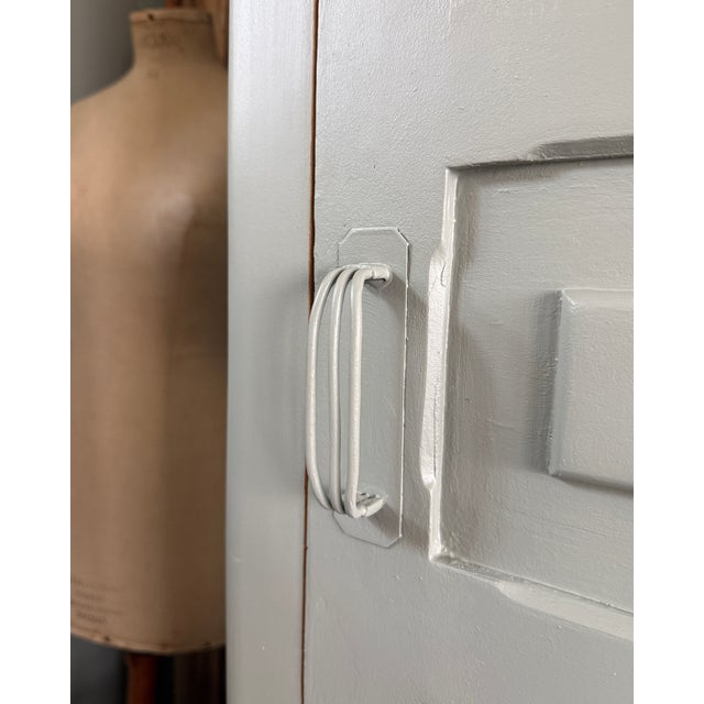 This 1940s wardrobe embodies the best of mass-produced art deco: rigorous geometry, a tall and slender silhouette, and a...