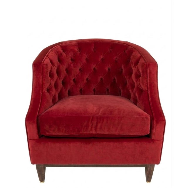 This classic button-tufted barrel accent chair combines vintage elegance with a bold modern presence. Wrapped in rich,...