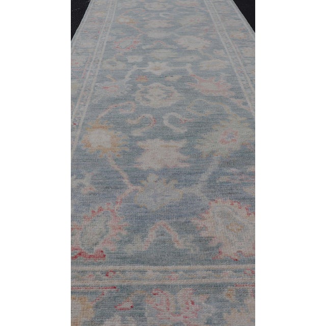 Traditional Floral Modern Oushak With Muted Blue Background in Wool 2'6 X 7'11 For Sale - Image 3 of 7
