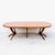 A beautifully refinished expandable walnut dining table with three large leaf extensions, made in the United States c....