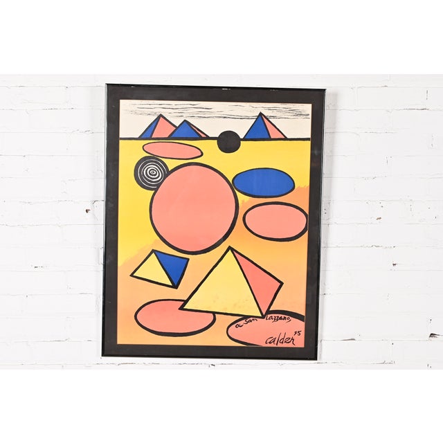 A beautiful vintage framed abstract lithograph By Alexander Calder USA, 1975 Measures: 25"W x 0.75"D x 31.25"H (including...