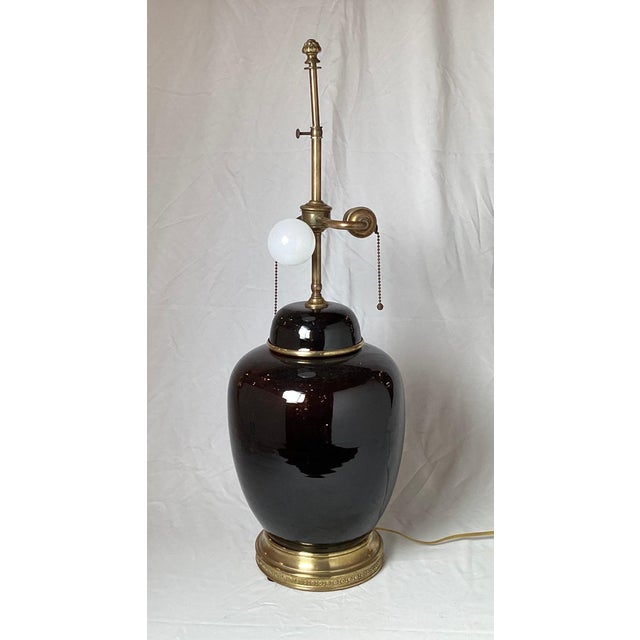 A stunning antique Chinese porcelain 19th century jar, as a lamp. The porcelain jar is in a Mirror black glaze, which is a...