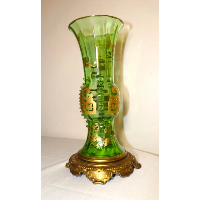 Up for sale is a very high quality antique hand blown Czech Bohemian art glass vase. it's blown out of a vibrant green...