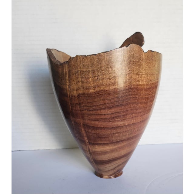 The D. Richardson 2012 Signed Ornamental Hand Turned Wood Vessel is a medium-sized, original sculpture vase made of Acacia...