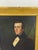 A mid-19th-century American Folk Art oil on board portrait of an unidentified young gentleman, in the New England School...