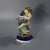 Minton Majolica salt which features a boy holding a shell, climbing over a dolphin. Colouration: grey, cobalt blue, blue,...