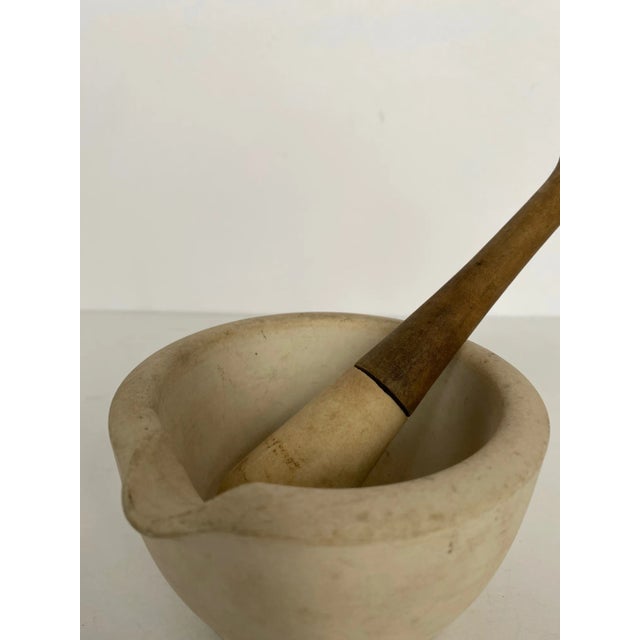 Antique mortar and pestle made by Thomas Maddock & Sons (1/0). Impressed marking on the bottom "Warranted T.M. & S. Acid...