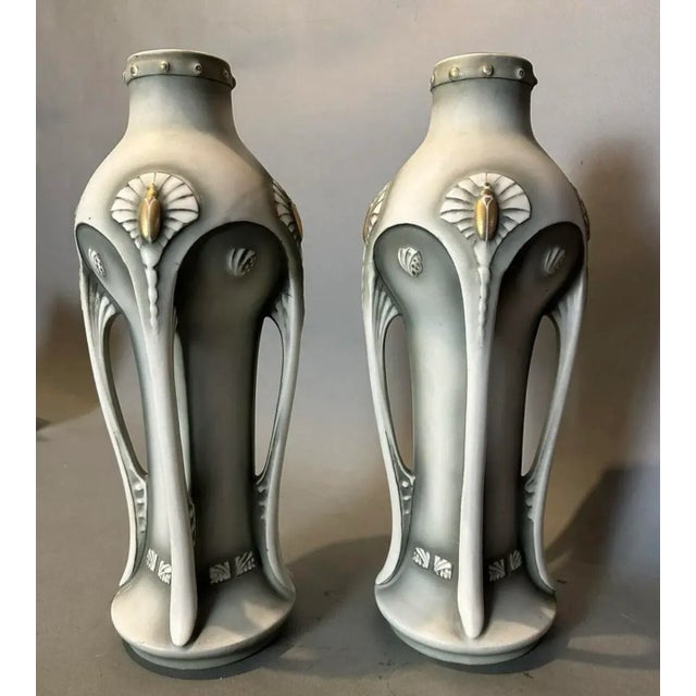 A large & Impressive Pair of Vintage Antique Art Nouveau Amphora Style Buttress Handled Vases Gilt decorated accents with...