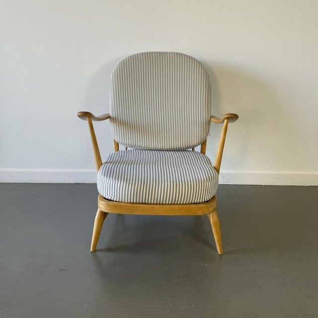 Refurbished vintage Ercol Windsor armchair, upholstered in French ticking. This piece is in good vintage condition. The...