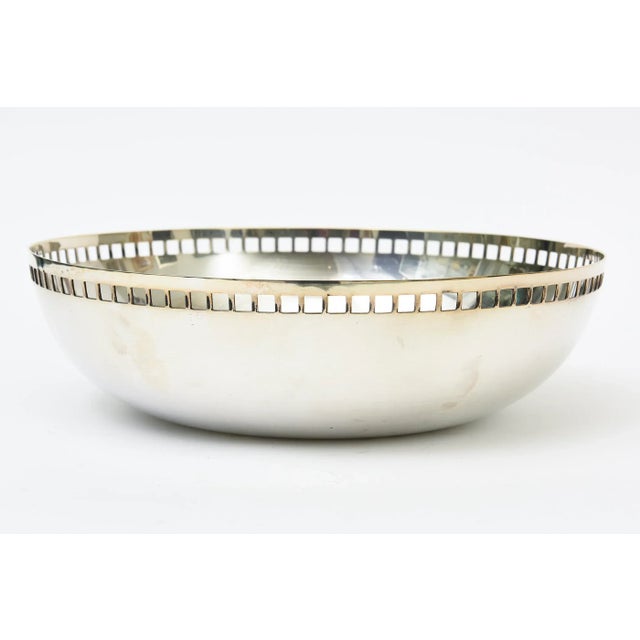 This iconic silver-plate bowl designed by Richard Meier for Swid Powell in Italy is the large version of the skyscraper...